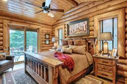 bedroom-windows-patio-door-wood-flooring-interior-dowell-golden-eagle-log-homes-2-2