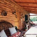 Handcrafted log home porch - learn these eight things about handcrafted homes